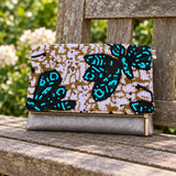 Turquoise Butterfly garden image with a long gold zipper pull