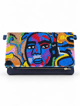 Outer Flame embellished fold-over clutch on a white background